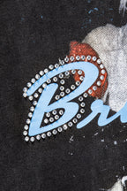 Balenciaga T-shirt detail with rhinestone letter graphic and blue outline