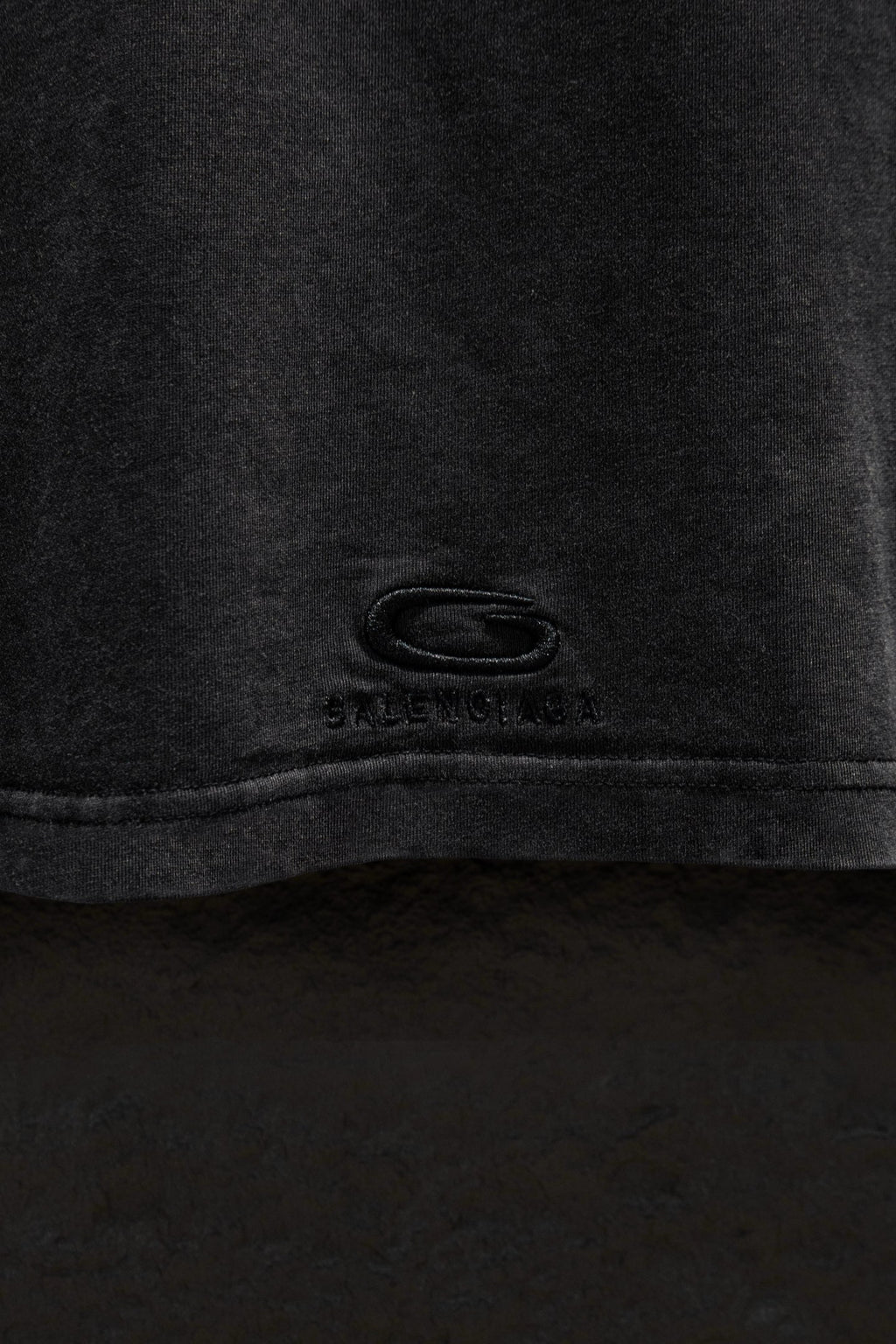 Balenciaga T-shirt hem with small logo marking at center