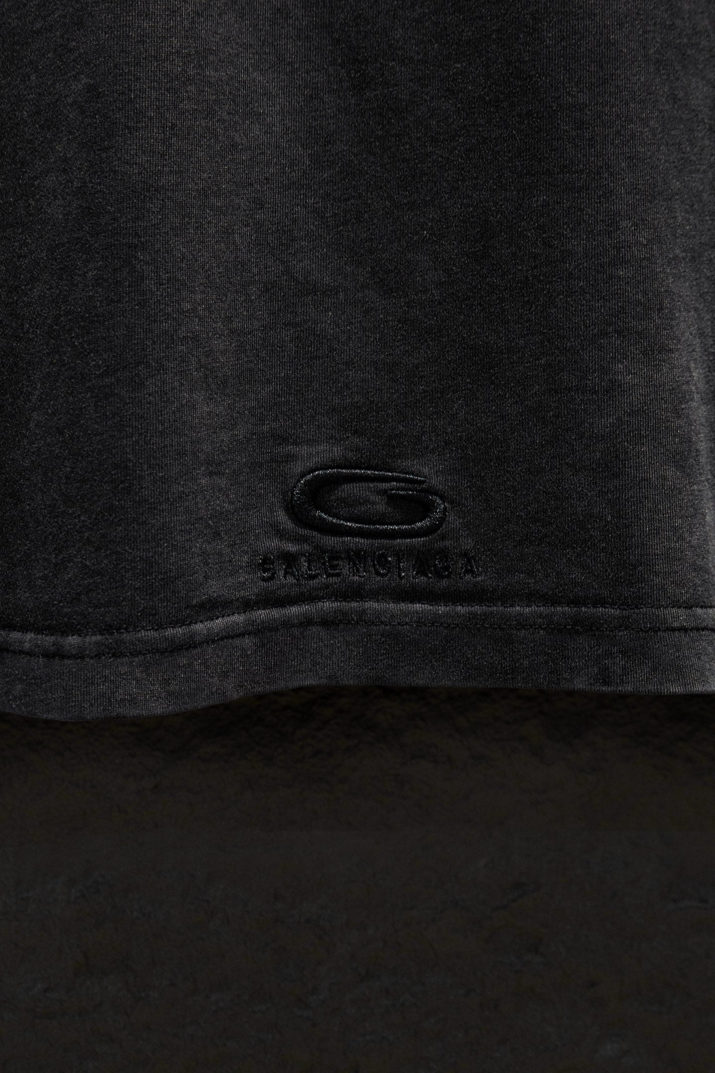 Balenciaga T-shirt hem with small logo marking at center