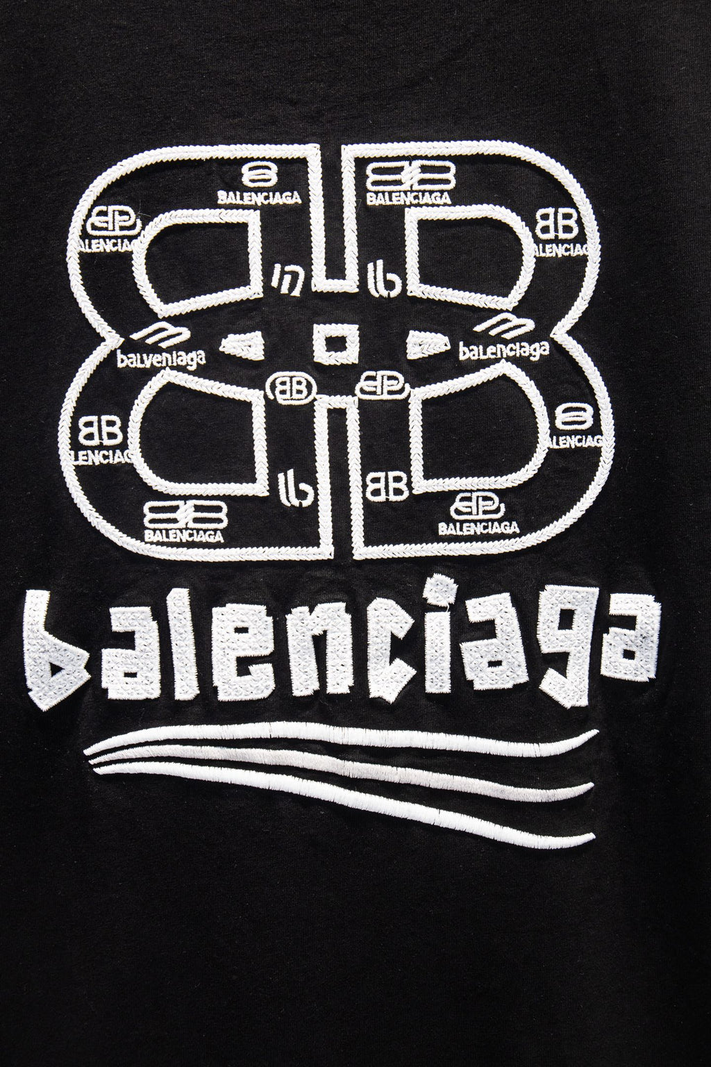 Black Balenciaga T-shirt with oversized circular and text logo graphic