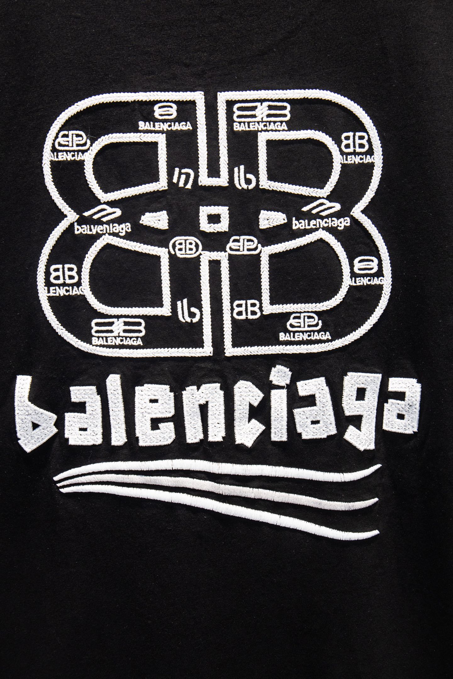 Black Balenciaga T-shirt with oversized circular and text logo graphic