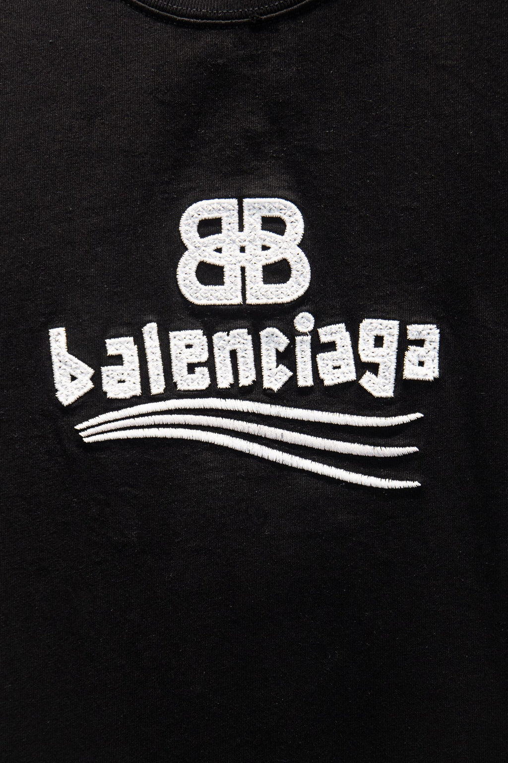 Black Balenciaga T-shirt with white Balenciaga logo and wave graphic