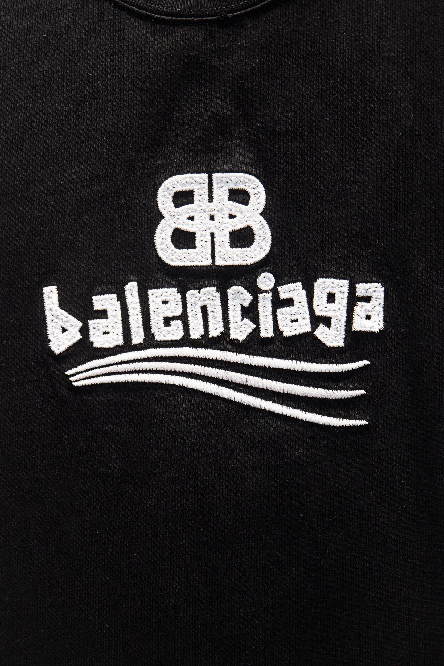 Black Balenciaga T-shirt with white Balenciaga logo and wave graphic