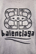 Light gray T-shirt with large centered Balenciaga logo graphic on chest
