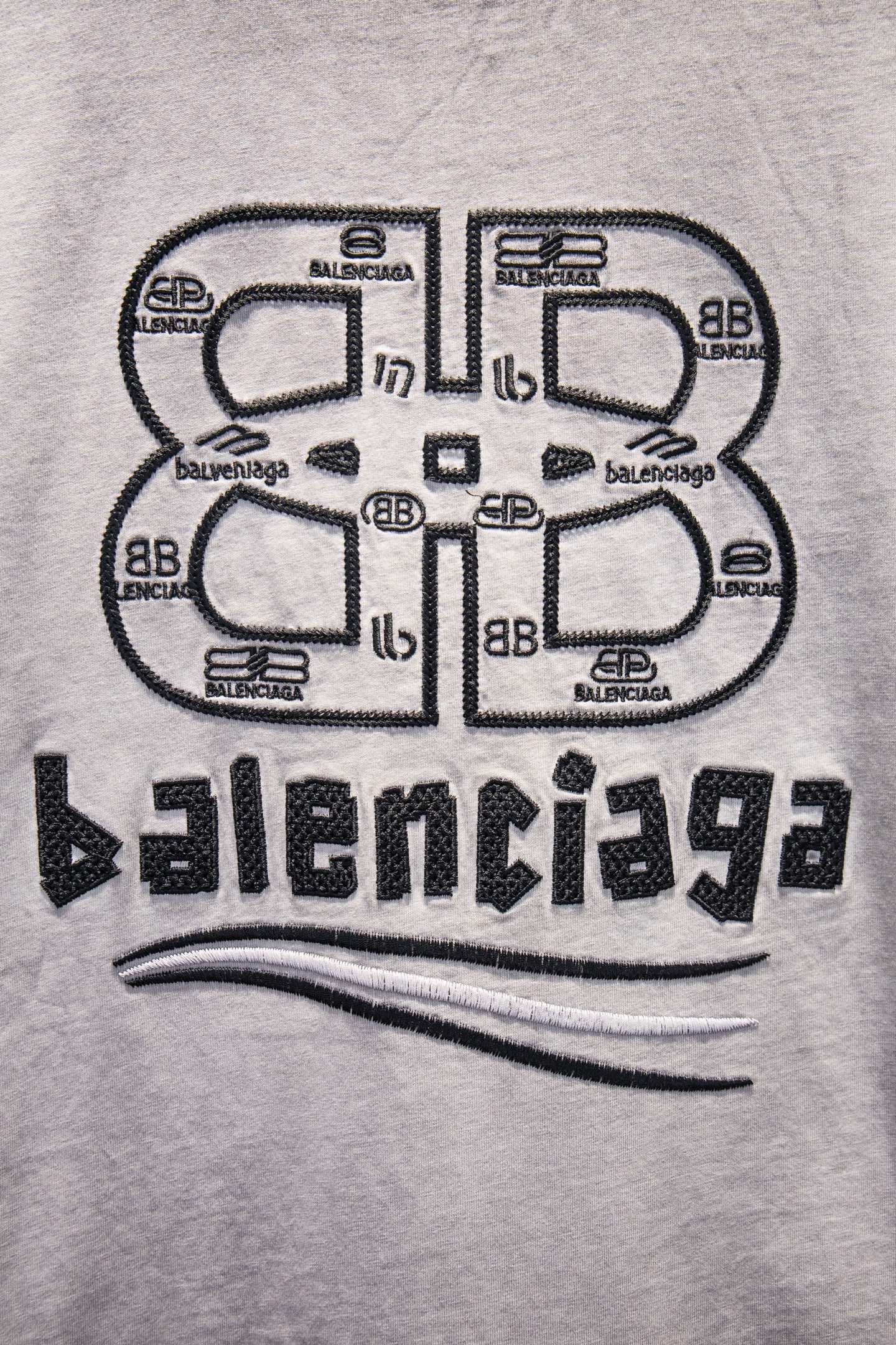 Light gray T-shirt with large centered Balenciaga logo graphic on chest
