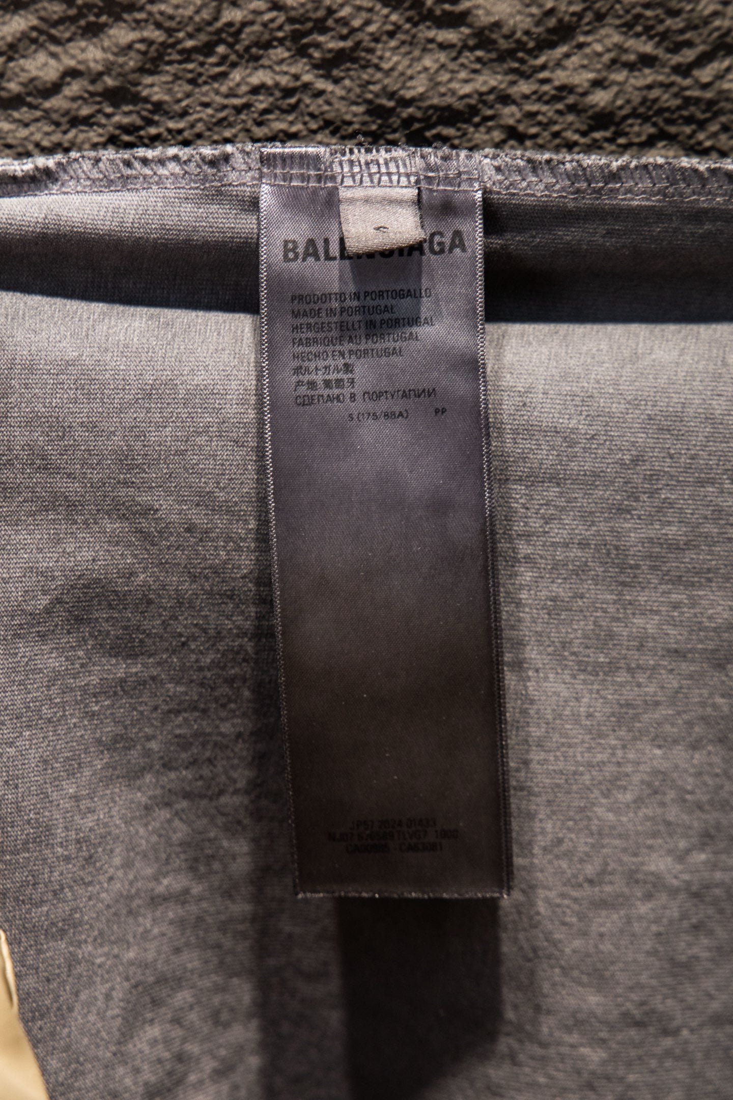 Light gray T-shirt inner neck fabric label with Balenciaga branding
