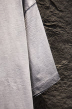 Light gray T-shirt with draped sleeve and side seam detail