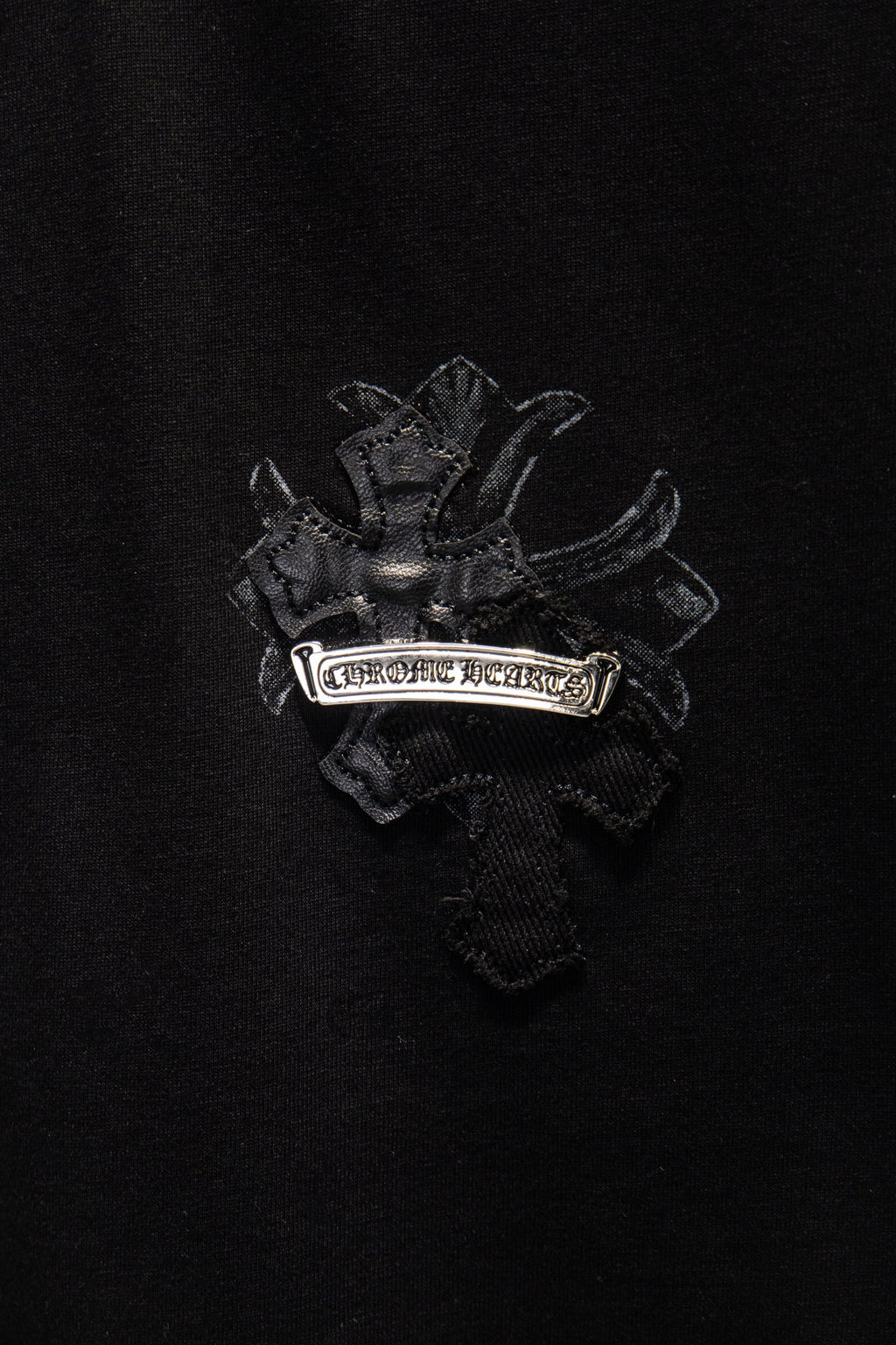 Black T-shirt with embroidered crest logo on chest