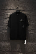 Black short-sleeve T-shirt with small chest graphic and round neckline