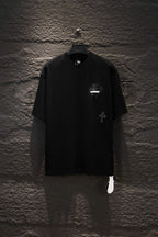 Black short-sleeve T-shirt with small chest graphic and round neckline