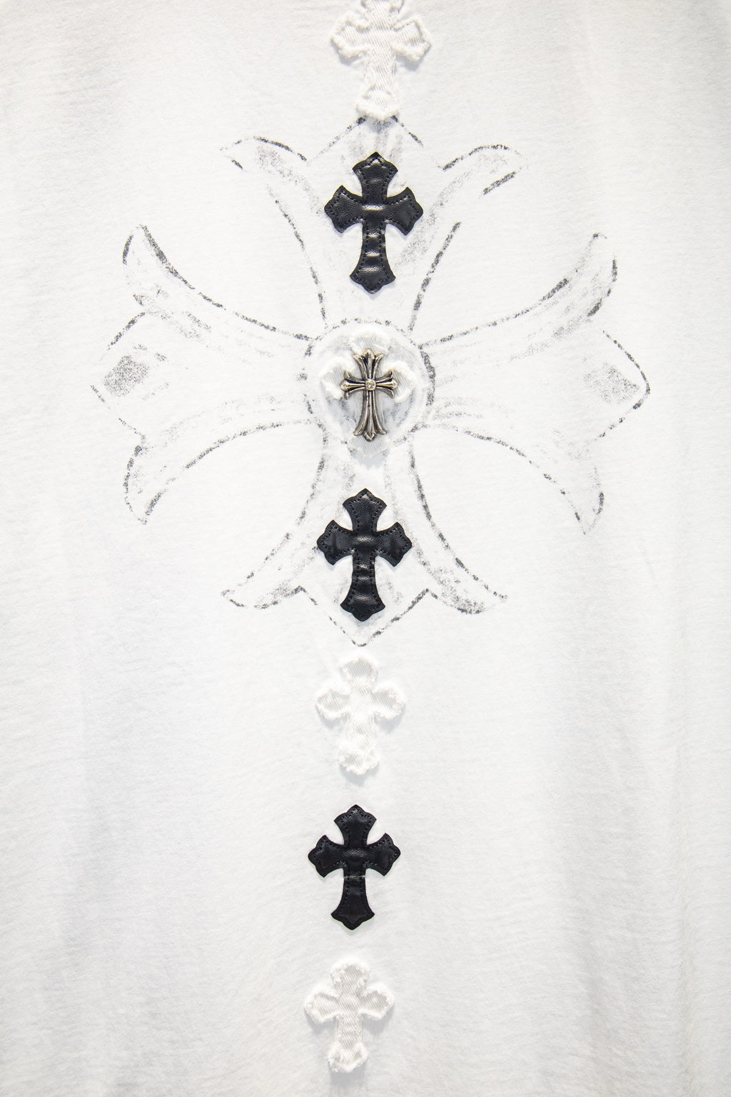 White T-shirt front with detailed cross graphic cluster in black and white