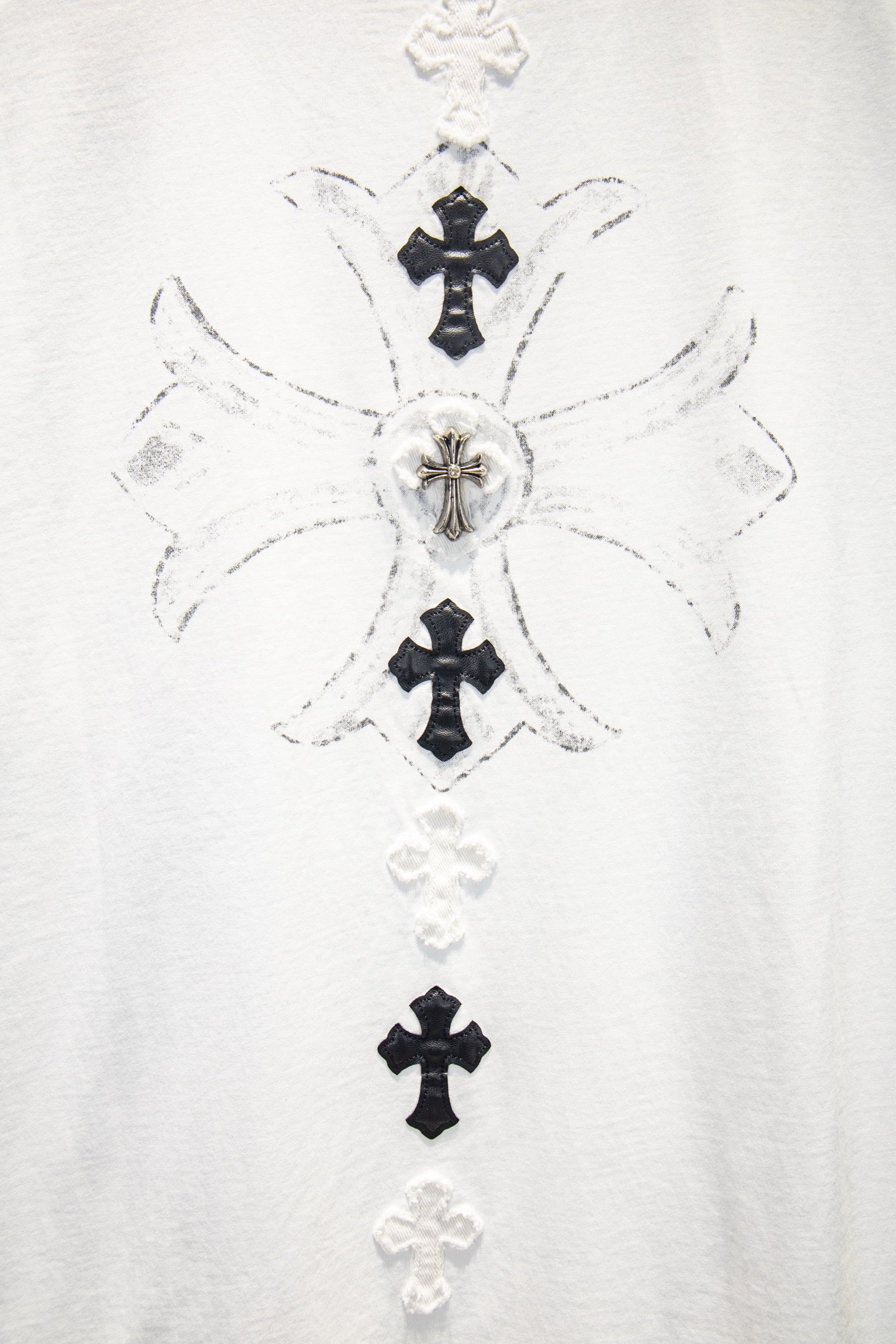 White T-shirt front with detailed cross graphic cluster in black and white