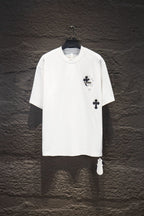 White short-sleeve graphic T-shirt with black cross emblem on the chest