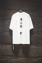 White short-sleeve graphic T-shirt with large back cross design and ribbon detail