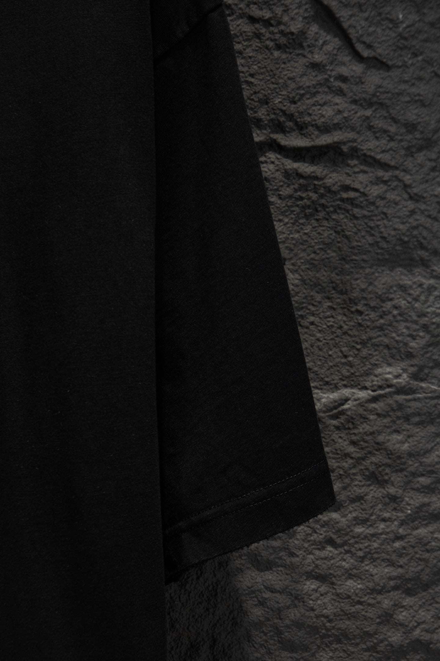 Black short-sleeve T-shirt side view with straight hem