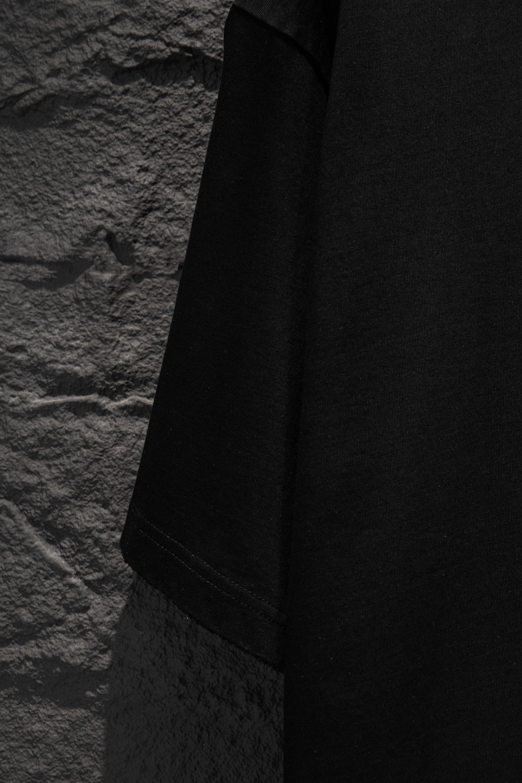 Black T-shirt sleeve and side panel view