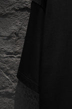 Black T-shirt sleeve and side panel view