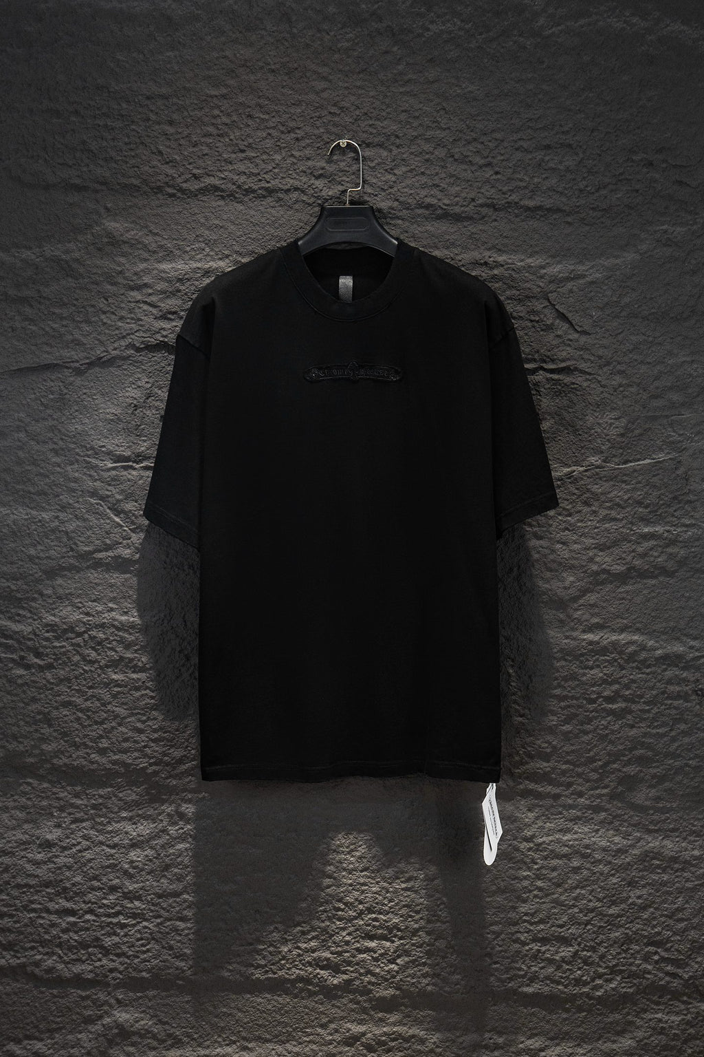 Black short-sleeve T-shirt with small chest logo print