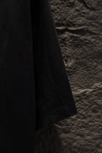 Black T-shirt sleeve hem and lower side view