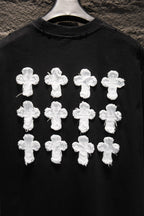 Black T-shirt front with multiple white cross appliques