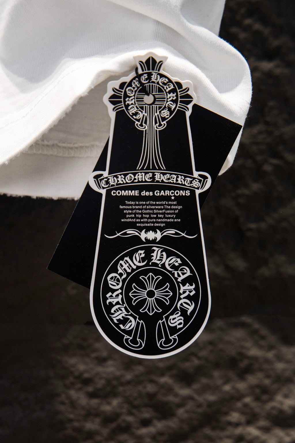 White T-shirt interior neckline with hanging Chrome Hearts tag