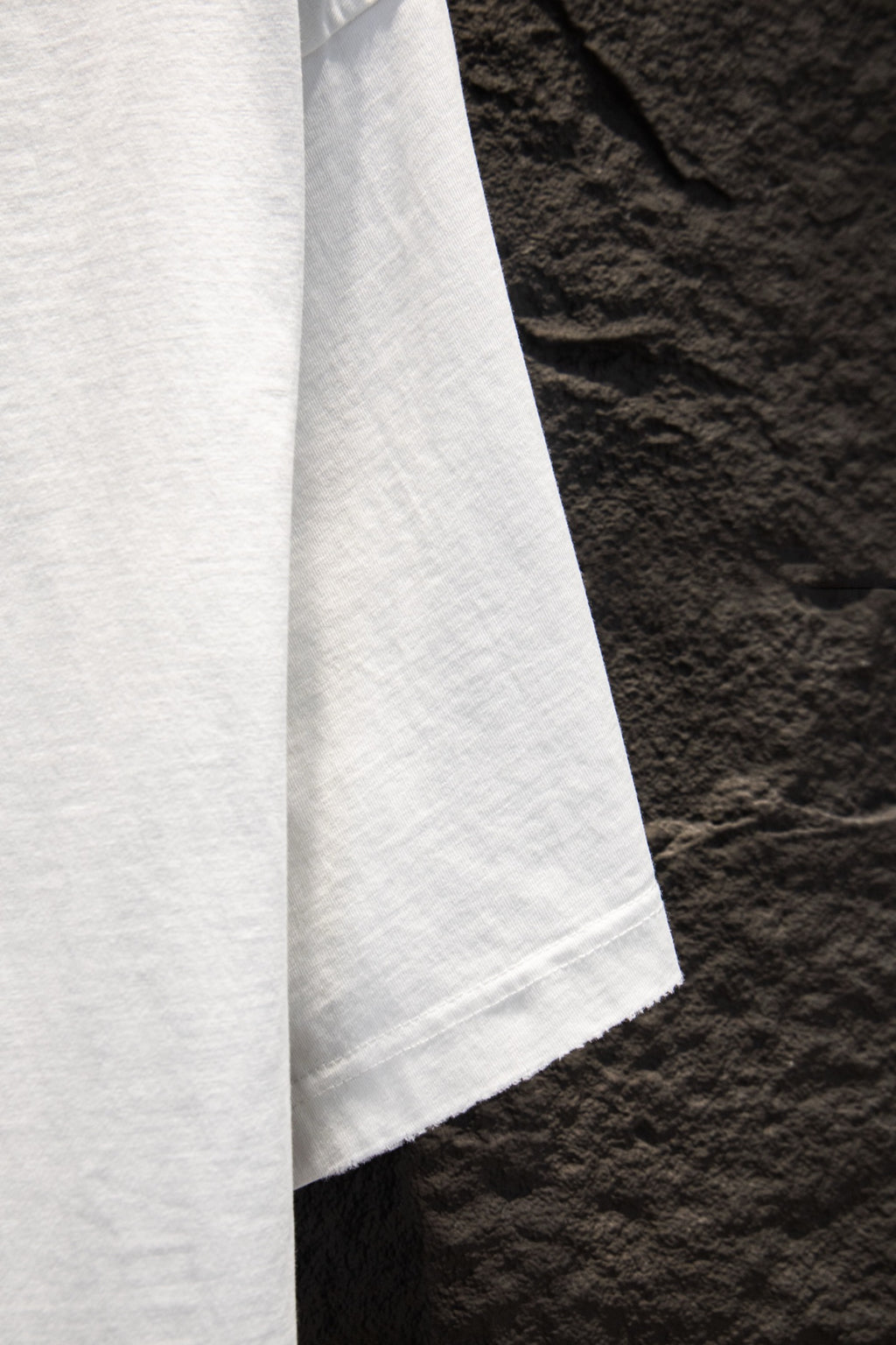 White short-sleeve T-shirt sleeve and side seam view