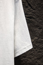White short-sleeve T-shirt sleeve and side seam view