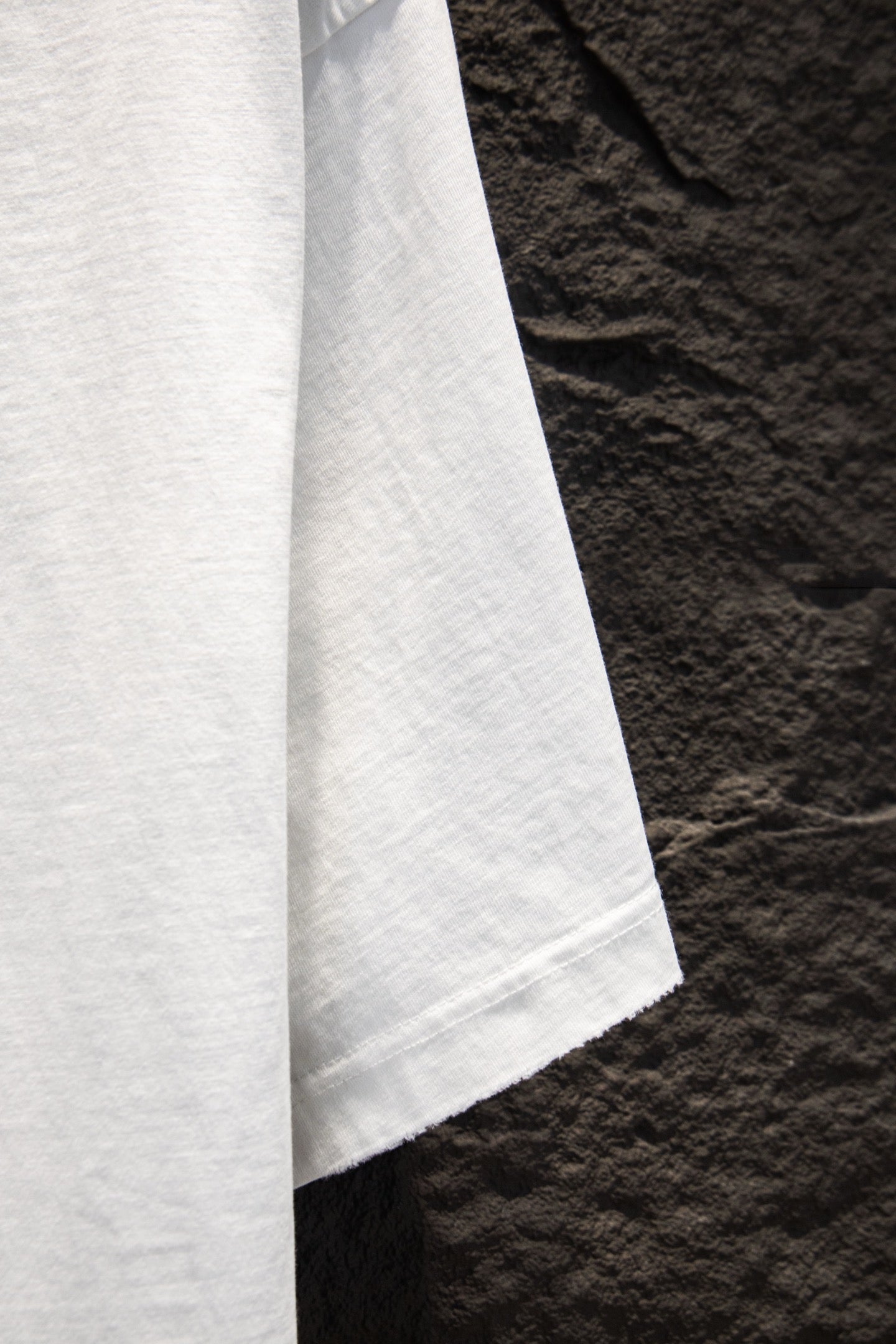White short-sleeve T-shirt sleeve and side seam view