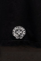 Black short-sleeve T-shirt lower back seam with small white circular logo