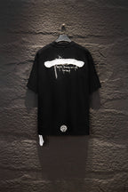 Black short-sleeve T-shirt back with white horizontal graphic and small emblem