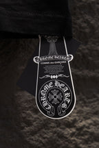 Black short-sleeve T-shirt with white designer hang tag