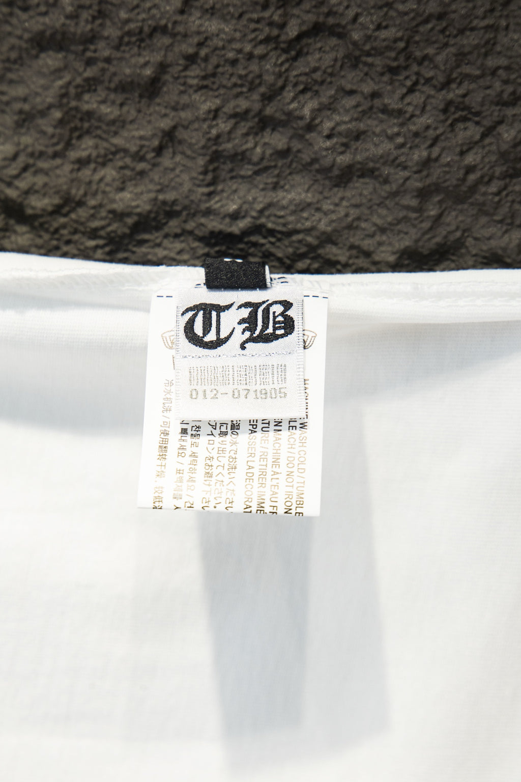 White T-shirt with interior care label tag at neckline seam