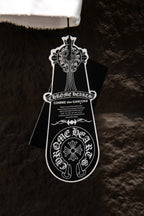 Black branded hang tag attached to T-shirt hem