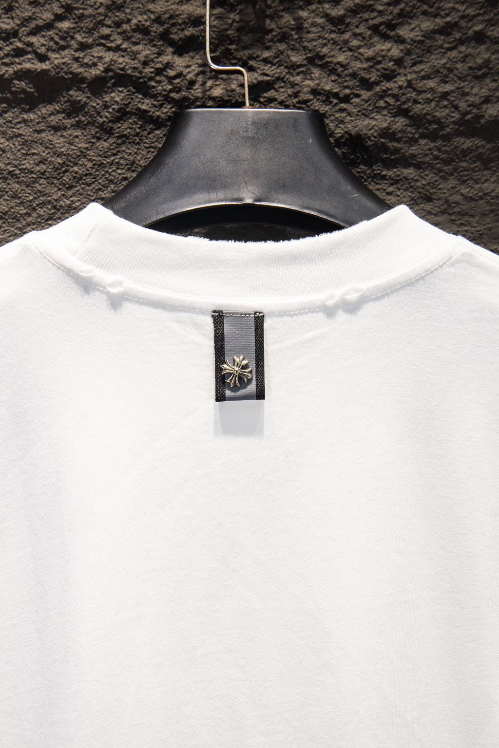 White T-shirt back neck with small brand label tag