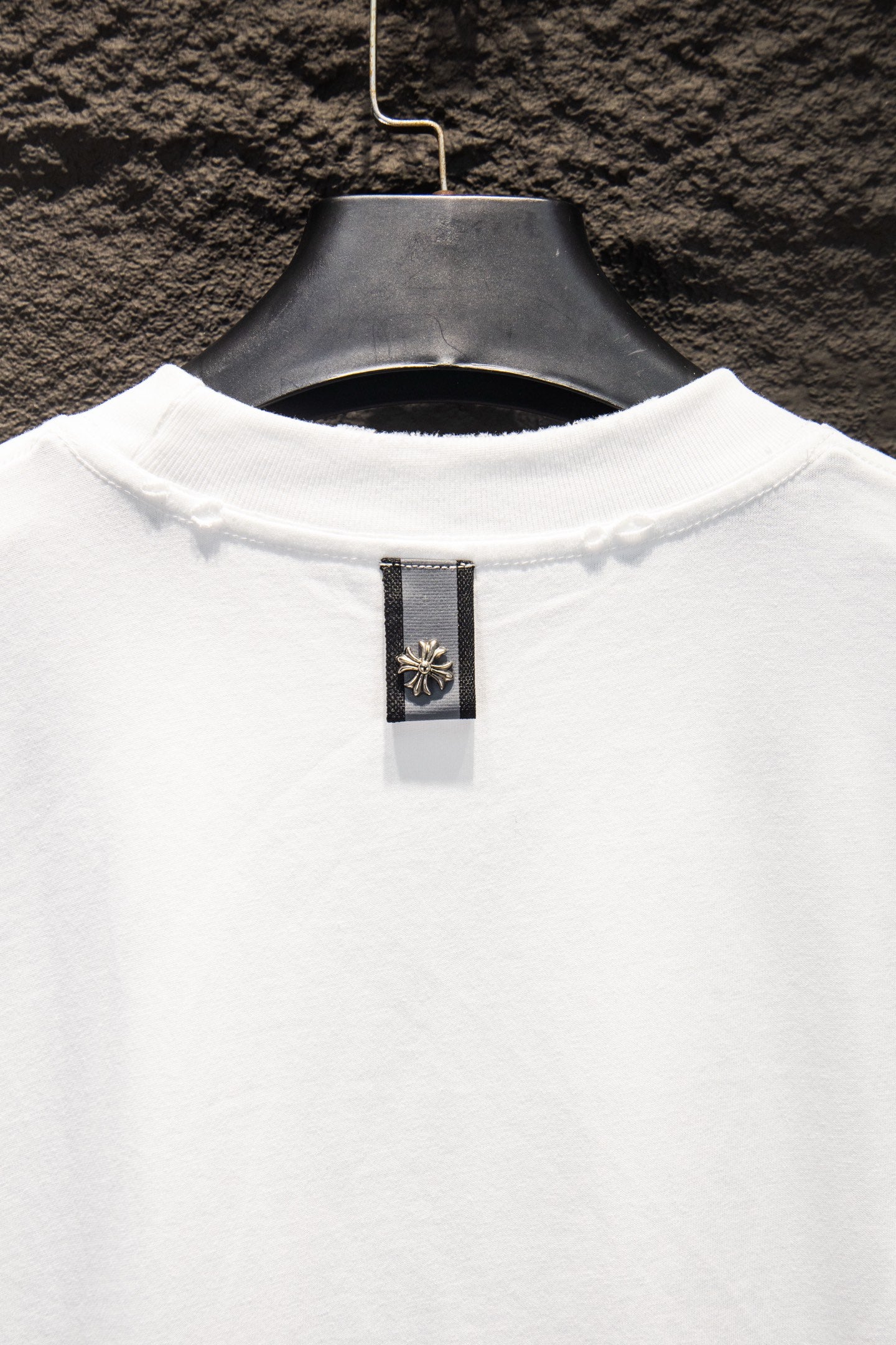 White T-shirt back neck with small brand label tag