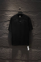 Black short-sleeve T-shirt with ornate chest embroidery and small center logo