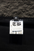 Black T-shirt interior label tag with size info attached