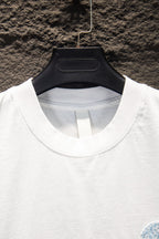 White T-shirt crew neck with partial light blue embroidered graphic detail