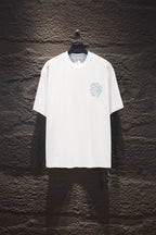 White short-sleeve T-shirt with light blue embroidered face graphic on chest
