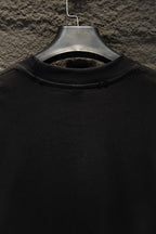Black short-sleeve T-shirt collar view on hanger