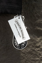Black T-shirt with hanging brand tag and printed label