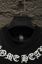 Black short-sleeve T-shirt collar and partial white logo text, on hanger