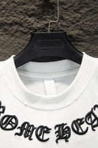 White T-shirt crew neck with black logo embroidery near shoulders