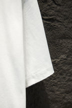 White T-shirt side view with hem and visible seam stitching