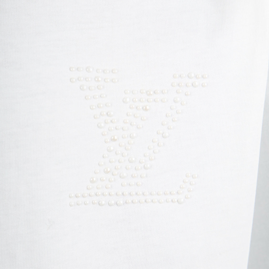 White T-shirt with raised studded logo graphic in tonal white.