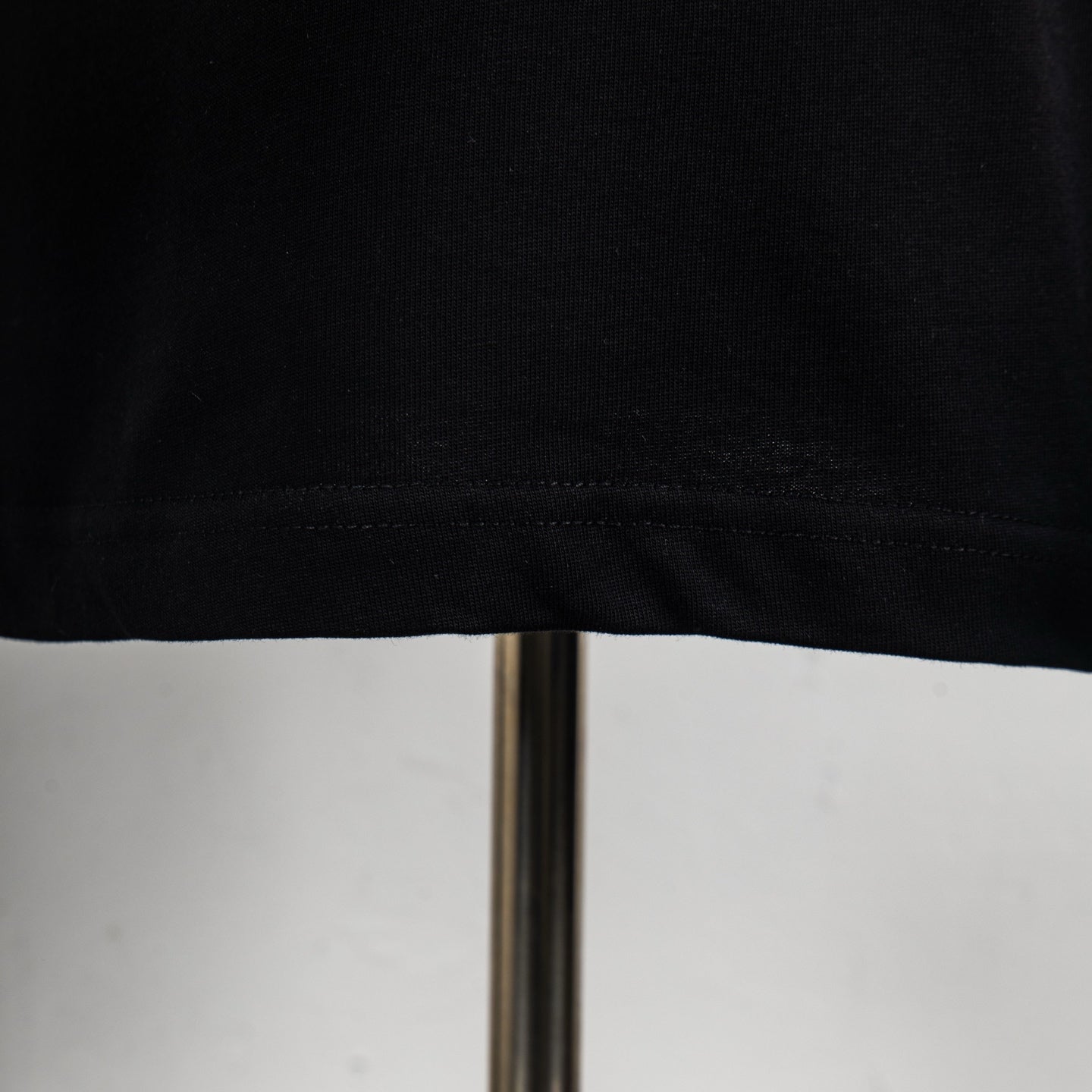 Louis Vuitton black T-shirt hem stitching, close-up