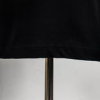 Black T-shirt hem with visible stitching