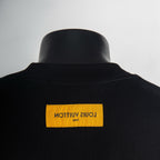 Louis Vuitton back neck label on black crew-neck T-shirt