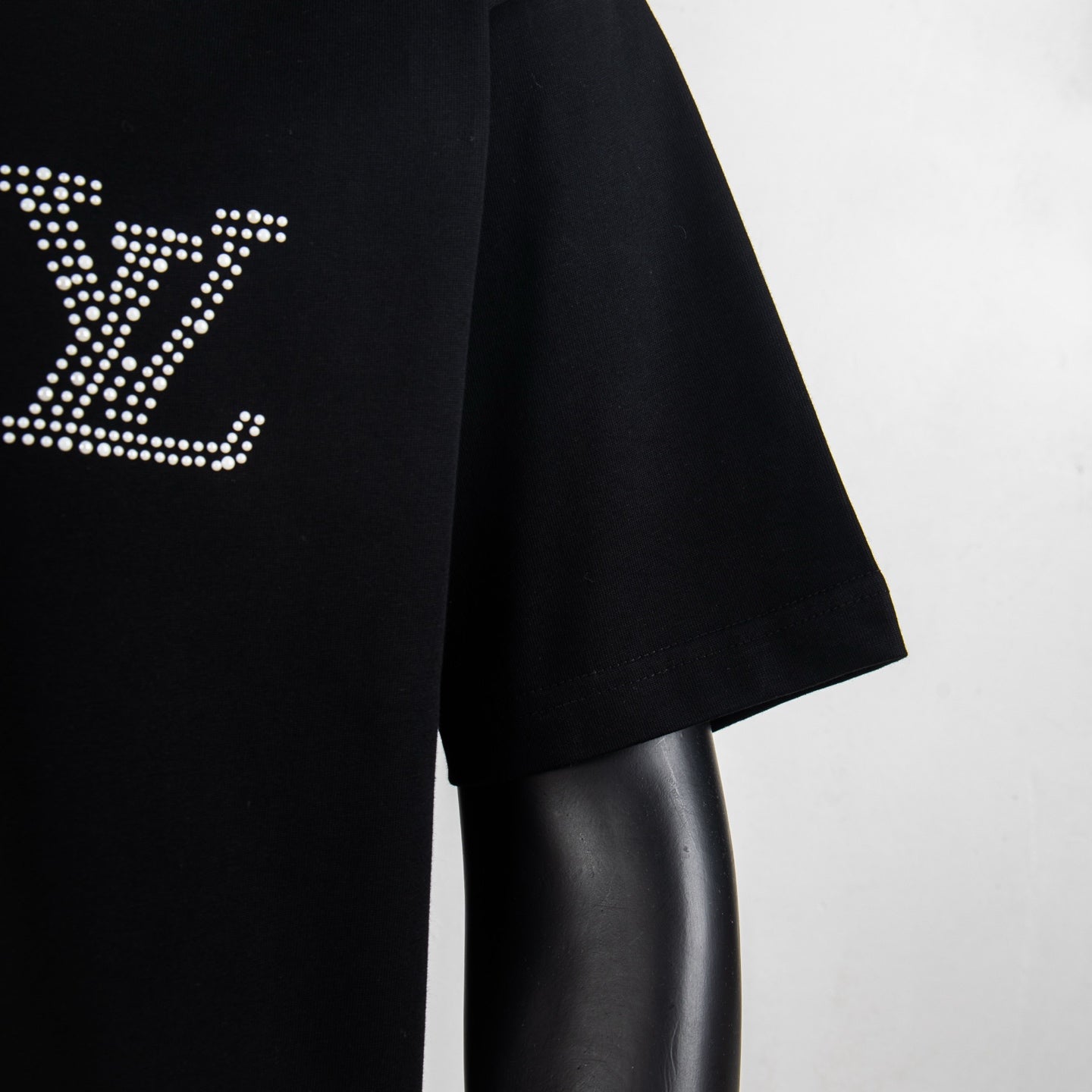 Louis Vuitton black short-sleeve T-shirt, angled side view