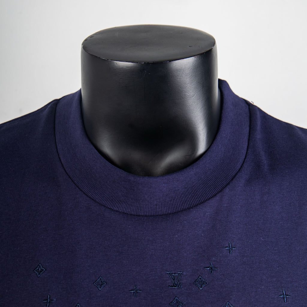 Navy crew-neck collar on short-sleeve top with small embroidered pattern motifs
